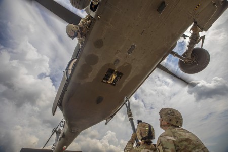 Army National Guard conduct a sling load exercise as part of the Exportable Combat Training Capability at Fort Cavazos, Texas, June 10, 2024. The training improves the service members’ readiness.