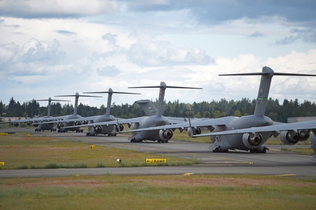 Air Force Globemaster IIIs taxi at McChord Field