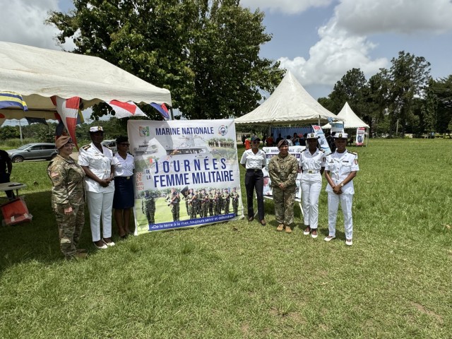 2nd Security Force Assistance Brigade (SFAB) advisors U.S. Army Chief Warrant Officer 3 Nichole Milani and U.S. Army Sgt. 1st Class Catherine Ponce, Engineer and Logistics Advisory Team advisors pose for a photo with Ivorian Armed Forces (Forces...