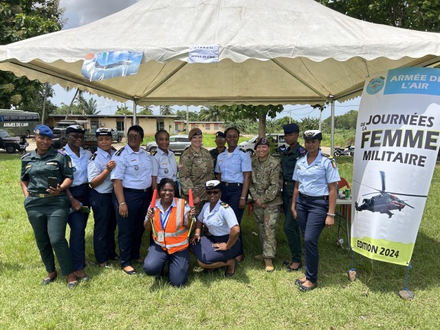 2nd Security Force Assistance Brigade (SFAB) advisors U.S. Army Chief Warrant Officer 3 Nichole Milani and U.S. Army Sgt. 1st Class Catherine Ponce, Engineer and Logistics Advisory Team advisors pose for a photo with Ivorian airmen (Forces Armées...