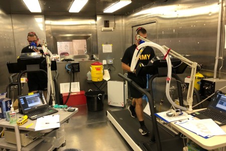 Two volunteers complete a bout of moderate-intensity exercise during a 36-hour residence period in the hypobaric chamber during a U.S. Army Research Institute of Environmental Research Military Nutrition Division nutrition intervention study in...