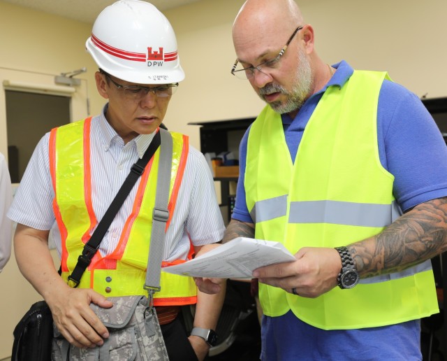 Satoru Itahashi, left, an electrical power dispatcher foreman, and Eli Craft, chief of operations and maintenance for U.S. Army Garrison Japan&#39;s Directorate of Public Works, participate in the &#34;Black Start&#34; exercise at Camp Zama,...