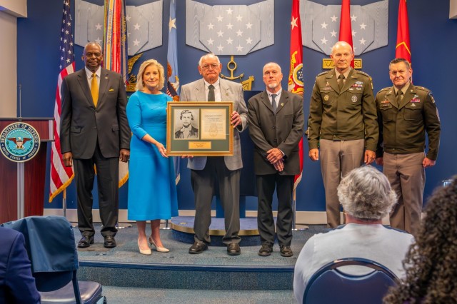 Gerald Taylor, the great-great-nephew of U.S. Army Pvt. Philip G. Shadrach, receives the Medal of Honor plaque on behalf of his ancestor during the Hall of Heroes Induction Ceremony at the Pentagon in Arlington, Va., July 4, 2024. Shadrach and...