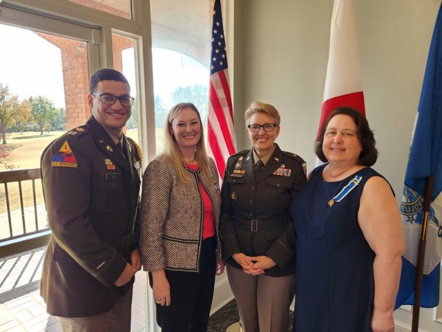 From left, Capt. Christopher Lee, former aide-de-camp to the former commanding general of Army Contracting Command Brig. Gen. Christine Beeler; Laura Lind, Beeler and Priscilla Adams Du Mont talk at the 2023 National Defense Luncheon in November...