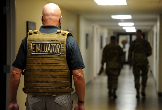 An evaluator observes the last full-scale exercise on post that took place in 2021.