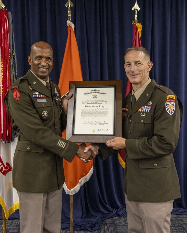 Maj. Gen. Jeth Rey presents certificate of promotion to Brig. Gen. Eric J. Van Den Bosch at his promotion ceremony 12 July 2024 on Fort Meade, MD.