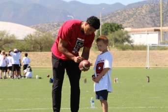 Arizona Cardinal coaches military youth at football camp