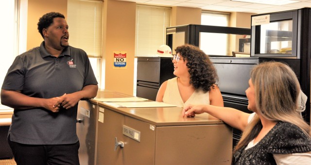Mike Berry, U.S. Army Corps of Engineers Nashville District realty specialist speaks with realty specialists Marianne Rivera and Angela Jones, July 17, 2024. The Nashville District recently announced Berry as the February employee of the month....