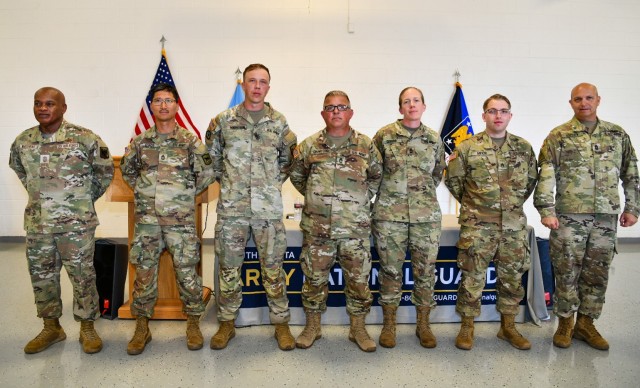 Senior Enlisted Advisor Tony L. Whitehead, senior enlisted advisor to the chief of the National Guard Bureau, presents coins of recognition to members of the 129th Mobile Public Affairs Detachment from South Dakota. The SEA toured facilities and met with Soldiers and Airmen of the South Dakota National Guard during their drill weekend July 14-15, 2024. (U.S. Army National Guard photo by Sgt. 1st Class Elizabeth Pena)