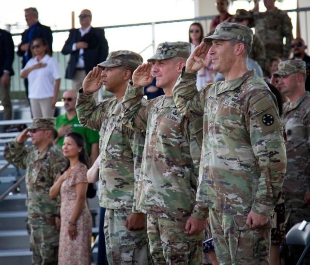 (Left to right) Col. Lane A. Bomar, Lt. Gen. Stephen G. Smith, and Brig. Gen. Brandon C. Anderson salute the U.S. flag during the playing of the U.S. National Anthem. Smith, the Deputy Commanding General of U.S. Army Forces Command, officiated the...