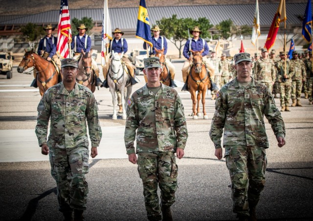 (Left to right) Col. Lane A. Bomar, Lt. Gen. Stephen G. Smith, and Brig. Gen. Brandon C. Anderson return to the reviewing stand during the National Training Center&#39;s 24th Assumption of Command Ceremony 18 June 2024. Smith, the Deputy...
