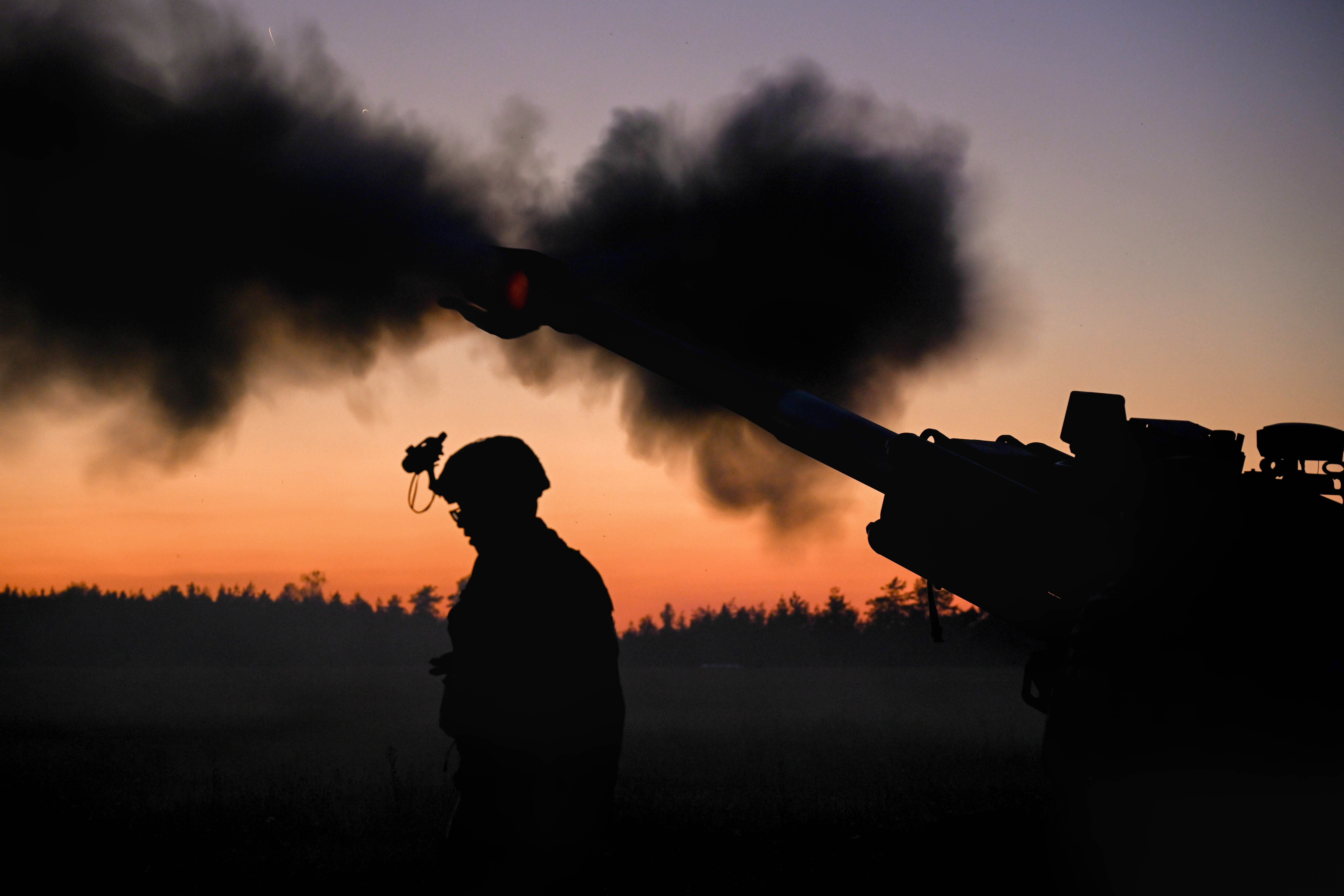 U.S. Army paratroopers assigned to Chaos Battery, 4th Battalion, 319th Airborne Field Artillery Regiment, 173rd Airborne Brigade, fire an M777 during a live fire exercise following a heavy drop airborne operation at the Grafenwoehr Training Area,...