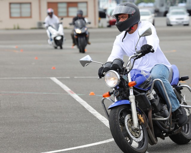 Wayne Knutson, who works for the Department of Defense Education Activity, practices a maneuver during the Basic Rider Course 1 at Yokohama North Dock, Japan, July 19, 2024. U.S. Army Garrison Japan recently restarted its motorcycle safety courses...