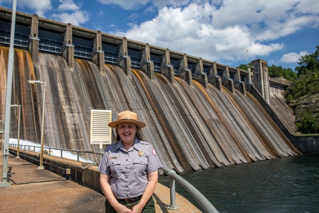 Park Ranger Amy Branscum in front of Norfork Dam