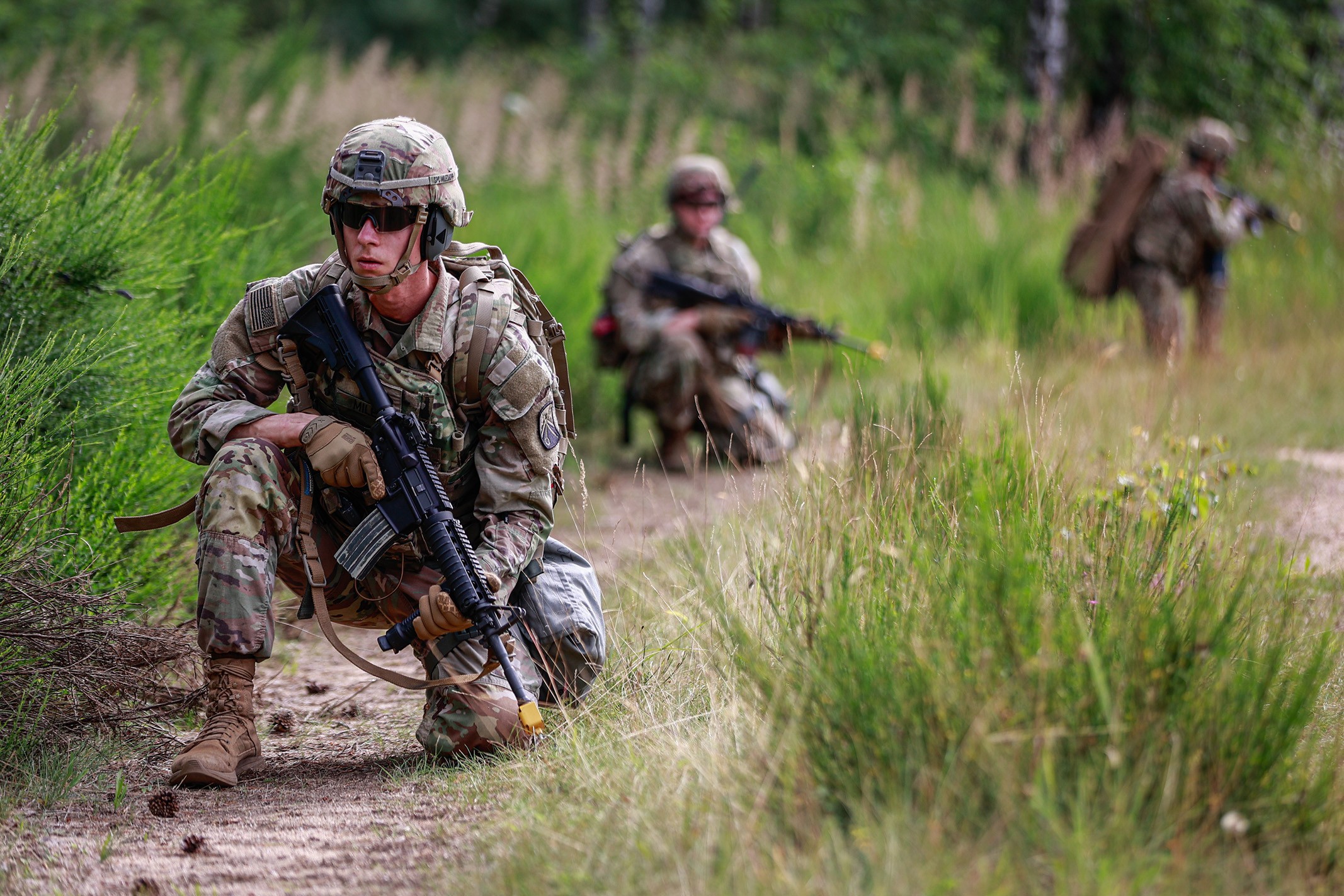 U.S. Army Sgt. Maksym Miles, 16th Sustainment Brigade, pulls security during a patrol during battle drills for the 21st Theater Sustainment Command Best Squad Competition on Camp Aachen, Grafenwoehr, Germany, on July 10, 2024. Day three of the...