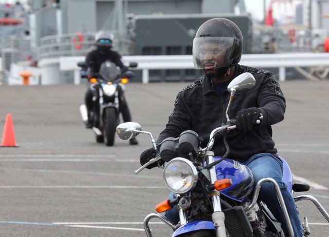Sgt. Michael Barnes, assigned to the 78th Signal Battalion, practices a maneuver during the Basic Rider Course 1 at Yokohama North Dock, Japan, July 19, 2024. U.S. Army Garrison Japan recently restarted its motorcycle safety courses after a...