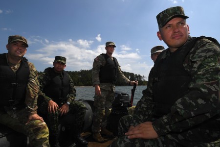 Maj. Jhon Chaparro, right, and Lt. Col. Jorge Flechas, second from left, both with the Colombian army’s engineer command, watch from a Combat Assault Craft as Soldiers with the 125th Multi-role Bridge Company, South Carolina Army National Guard...