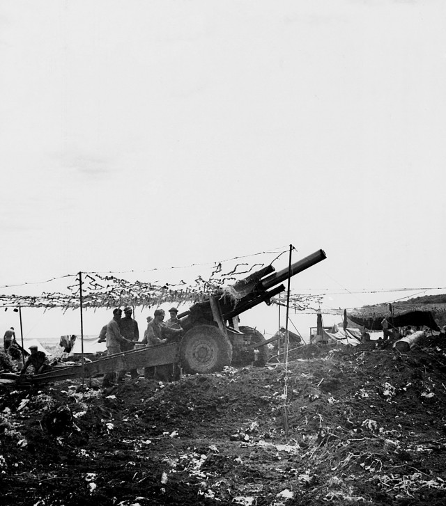 Army 155mm howitzer on Tinian, providing fire support during the assault. 28 July 1944. Much of the combat service support for the Tinian operation was provided by the Army.