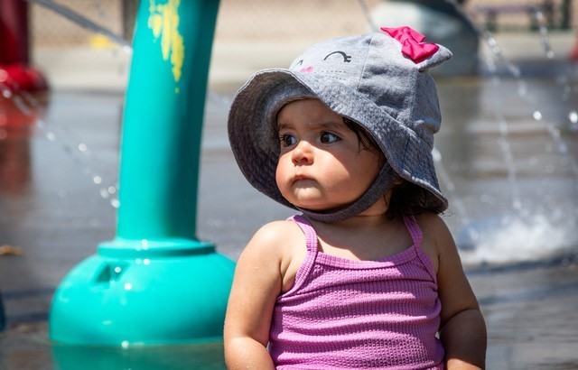 A military child beats the heat by enjoying the Fort Irwin Splash Park on 2nd Street; one of the several R2 facilities available on Fort Irwin.