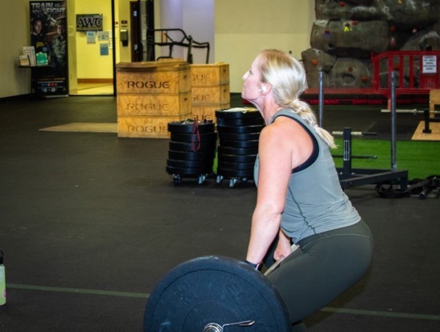 Rotational visitor Capt. Martha Lane-Kinnett, an Aide De Camp with 3rd Infantry Division, conducts PT at the Box Gym; one of the several R2 facilities available at the Fort Irwin Army Wellness Center.