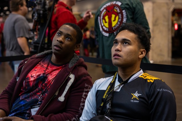 Sgt. Eduardo "EJ" Gonzaga plays Super Smash Bros against one of the event goers at MegaCon, in Orlando, Florida. The Marketing and Engagement Brigade's eSports athletes attend events like MegaCon to interact with the public and increase public awareness about the Army (U.S. Army Photo by Sgt. Lauren Gajeton).