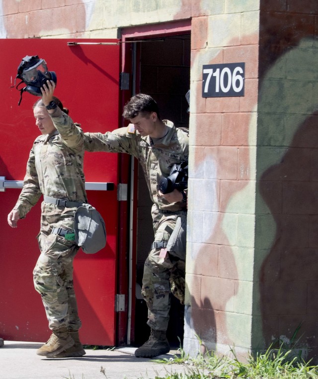 Cadet Rosalyn Page leads her team out of the gas chamber as part of chemical, biological, radiological, nuclear training during Phase II of Advance Camp at Cadet Summer Training on Fort Knox, Kentucky, July 19, 2024. She will refine her leadership tasks through land navigation, first aid, basic rifle marksmanship, hand grenade, and CBRN training 