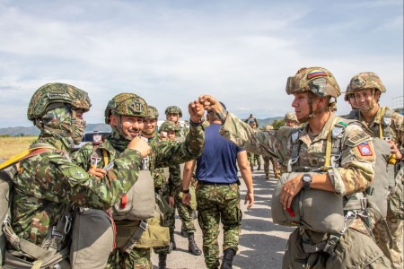 Colombian army paratroopers from Battalion of Counter Narcotics (BACN1 and U.S. Army paratroopers from 2nd Battalion, 508th Parachute Infantry Regiment, 2nd Brigade Combat Team, 82nd Airborne Division, wish each other well before their final jump...