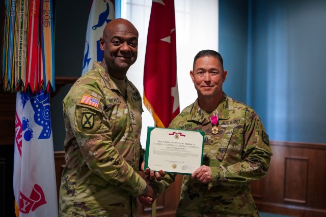 FORT LEAVENWORTH, Kansas, 240806-A-OD829-1006-- Lt. Gen. Milford H. Beagle Jr., commander U.S. Army Combined Arms Center (CAC) takes a photo with Command Sgt. Maj. (CSM) Stephen H. Helton, CAC CSM after presenting the Legion of Merit award at the...