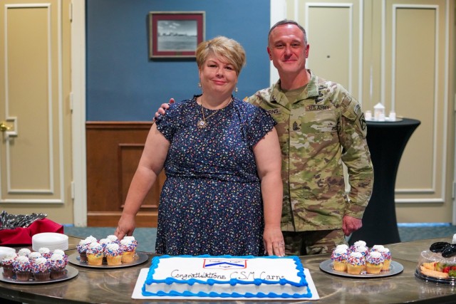 FORT LEAVENWORTH, Kansas, 240806-A-OD829-1063-- U.S. Army Combined Arms Center (CAC) Command Sgt. Maj. Shawn F. Carns and his wife Mrs. Theresa Carns pause for a picture after his change of responsibility ceremony where he relieved the outgoing...