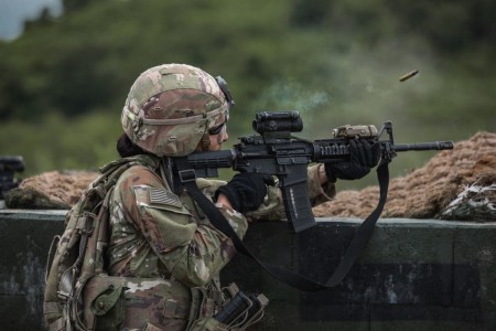 U.S. Army Soldier, Pfc. Andrea Flores, assigned to 4-70th Armor Regiment, 1st Armored Division, fires an M4 Carbine during a team live fire exercise at Nightmare Range, near Pocheon, South Korea, August 3, 2024. The unit is participating in a...