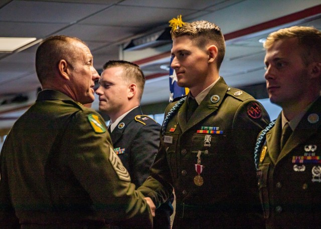 U.S. Army Command Sgt. Maj. John T. Raines, left, the command sergeant major of the Army National Guard, shakes hands with New York Army National Guard  Sgt. Peter Fillion, an infantryman who won the  2024 Army National Guard Best Warrior Competition,  held in Jericho, Vermont,  on Aug. 8, 2024. The Army National Guard Best Warrior Competition was a five-day event composed of 14 competitors representing the regional winners; the competition tests Soldiers’ physical and mental prowess with a series of events with the overall winners receiving either Soldier of the Year or Non-commissioned Officer of the Year recognition.