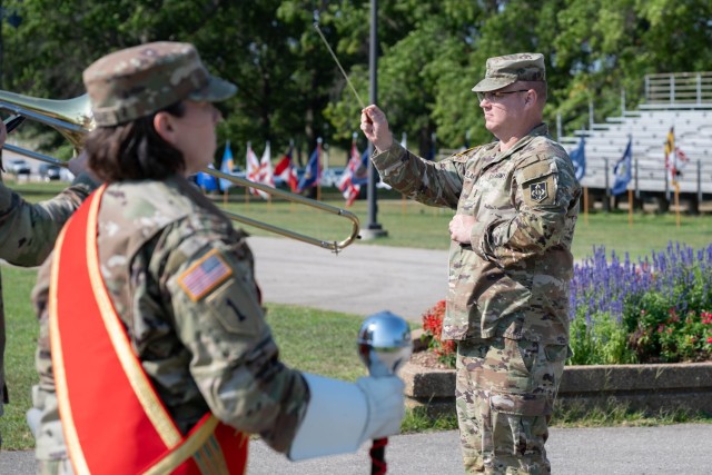 399th Army Band Commander and Bandmaster Chief Warrant Officer 4 Jared DeLaney prepares the band for their final review ceremony performance during a change-of-command ceremony for 169th Engineer Battalion Aug. 9 on Gammon Field. The band was...