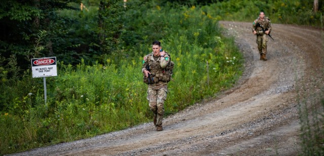 New York Army National Guard Sgt. Peter Fillion, the winner of the Army National Guard&#39;s 2024 Best Warrior competition, rucks down steep terrain in the 12 mile final event during the 2024 Army National Guard Best Warrior Competition at the Army Mountain Warfare School, Jericho, Vermont, Aug. 8, 2024. The Army National Guard Best Warrior Competition was  a five-day event composed of 14 competitors representing the regional winners; the competition tests Soldiers’ physical and mental prowess with a series of events with the overall winners receiving either Soldier of the Year or Non-commissioned Officer of the Year recognition.