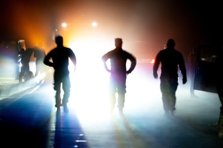 Task Force Pegasus Troopers stand silhouetted before attempting to complete the Norwegian Foot March on Forward Operating Site Powidz, Poland, Aug. 8, 2024. Task Force Pegasus has joined with Allied Nation Soldiers and local co...