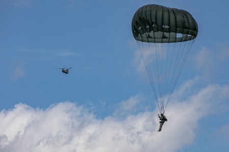 A U.S. Army Paratrooper descends to drop zone using his MC-6 Parachute during Leapfest 2024 at Glenrock Drop Zone, Exeter, Rhode Island, August 3, 2024. Leapfest is the largest, longest standing, international static line parachute training event...