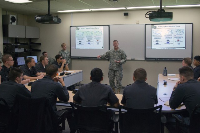 Command Sgt. Maj. Rodney Harris, senior enlisted leader for Army Cyber Command (ARCYBER) (center), and Brig. Gen. Patricia Frost, ARCYBER Deputy Commanding General for Operations (at rear left), welcome new officers to the Army's new Cyber branch,...