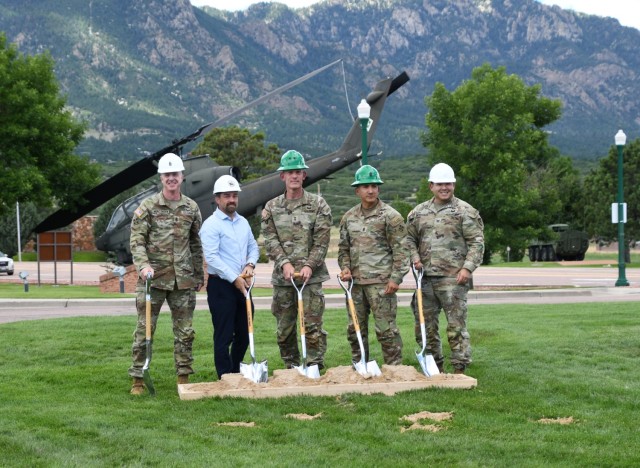FORT CARSON, Colo. — Maj. Gen. David Doyle, center, commanding general, 4th Infantry Division and Fort Carson, along with Col. Erik Oksenvaag, right, Fort Carson garrison commander; Garrison Command Sgt. Maj. Jason R. Mortensen, left; retired...