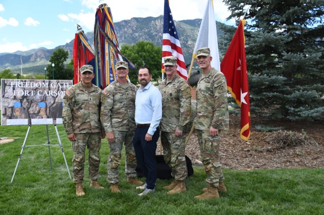 FORT CARSON, Colo. — Maj. Gen. David Doyle, far right, commanding general, 4th Infantry Division and Fort Carson, along with Command Sgt. Maj. Alex Kupratty, far left; retired Staff Sgt. Clinton Romesha, center; Sgt. Maj. Holland, second from...
