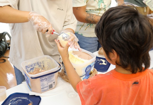 Soldiers from the 38th Air Defense Artillery Brigade serve ice cream to residents of the Sagamihara Minami Children's Home during an exchange event in Sagamihara, Japan, Aug. 14, 2024. The event allowed the soldiers to help the residents share their...