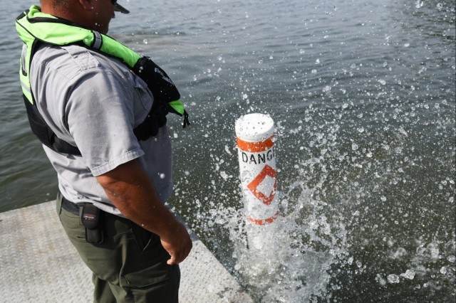 USACE Rangers place buoys on Lake Barkley to warn boaters of shallow water