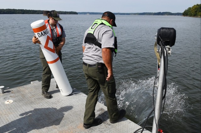 USACE Rangers place buoys on Lake Barkley to warn boaters of shallow water