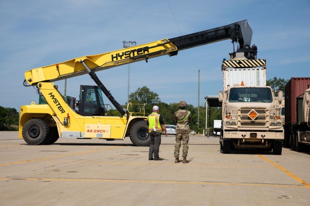 Blue Grass Army Depot civilain employees unload a container of ammunition off a trailer for the Fort Eisenhower-based 1148th Transportation Company, 110th Combat Sustainment Support Battalion, 78th Troop Command, Georgia Army National Guard,...