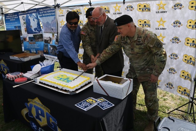 From left, U.S. Army Yuma Proving Ground (YPG) Technical Director Larry Bracamonte, Command Sgt. Maj. Herbert Gill, retired YPG Commander Col. Robert Filbey, and current YPG Commander Col. Patrick McFall cut the celebratory cake at a ceremony...