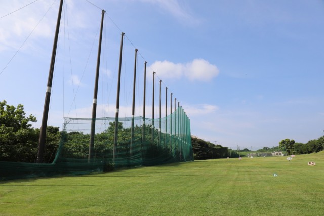 Contractors work on a net on the driving range at Camp Zama Golf Course in Japan on August 19, 2024. The course is currently undergoing extensive repairs to the mesh netting as part of an ongoing effort to keep balls within the course perimeter.