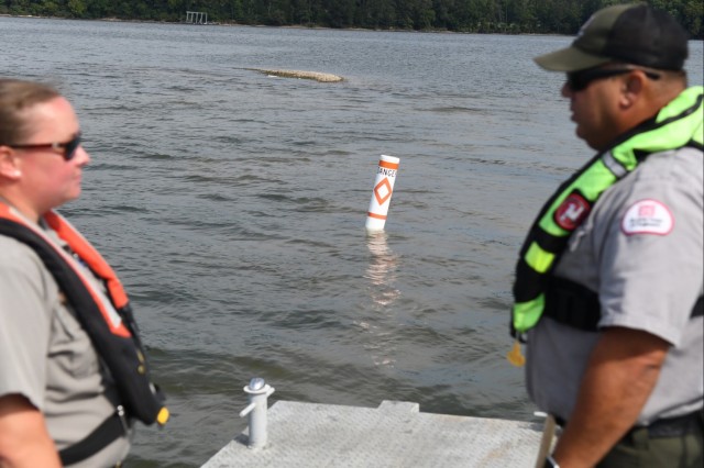 USACE Rangers place buoys on Lake Barkley to warn boaters of shallow water