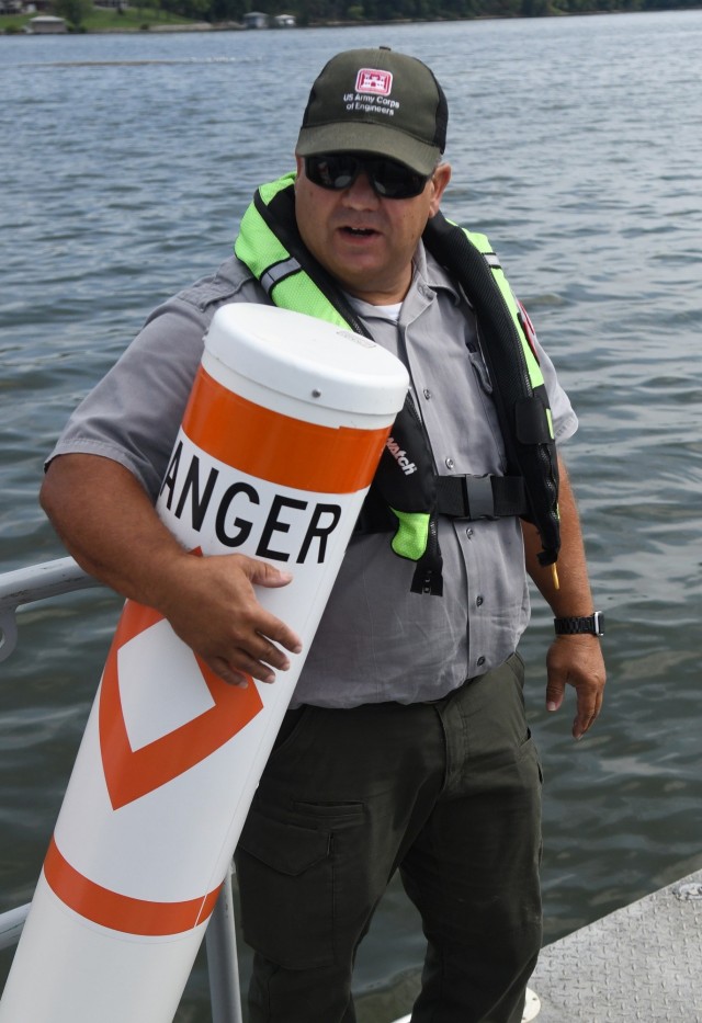 USACE Rangers place buoys on Lake Barkley to warn boaters of shallow water