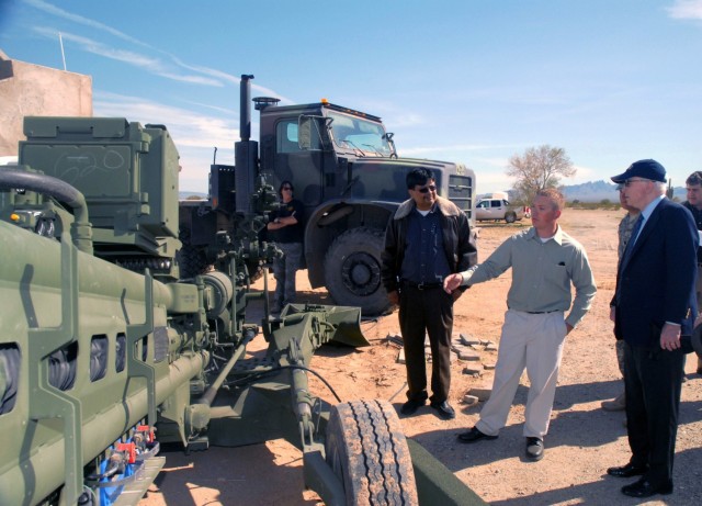 U.S. Army Yuma Proving Ground (YPG) Technical Director Lazaro &#34;Larry&#34; Bracamonte (left) escorts Senator John McCain (right) on a tour of the installation in this 2010 photo.
