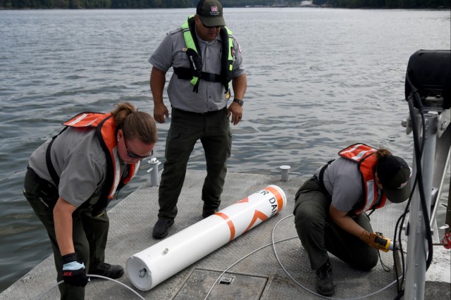 USACE Rangers place buoys on Lake Barkley to warn boaters of shallow water