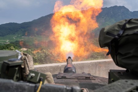 An M1A2 SEP v2 Abrams assigned to Bravo Company, 4th Battalion, 70th Armored Regiment, 1st Armored Brigade Combat Team, 1st Armored Division, fires at a target during a zero range at Rodriguez Live-Fire Complex, South Korea, Aug. 5, 2024. The unit...