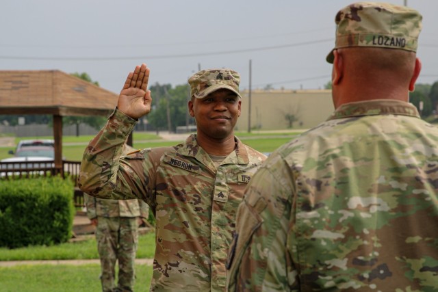 Sergeant Kevin Negron of Headquarters and Headquarters Company, 89th Military Police Brigade, takes the oath of office during a reenlistment ceremony May 21, 2024, at Fort Cavazos, Texas. (U.S. Army photo by Sgt. Alexander Chatov)